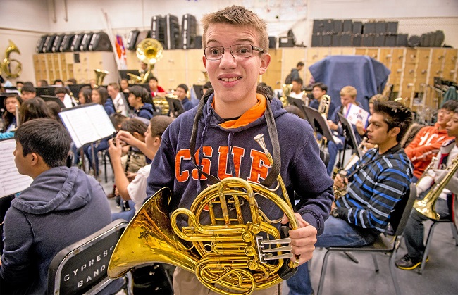 Freshman French horn player Brent Dillard, 15,