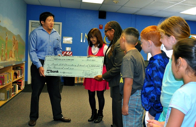 Diamond Bar Friends of the Library President Chris Ko presented $1,000 to the Maple Hill library. 