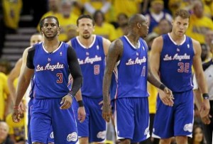 Los Angeles Clippers' Chris Paul, Hedo Turkoglu (8), Jamal Crawford (11) and Blake Griffin (32) walk back to their bench in the closing minutes of a 118-97 loss to the Golden State Warriors during the second half in Game 4 of an opening-round NBA basketball playoff series on Sunday, April 27, 2014, in Oakland, Calif. (AP Photo/Marcio Jose Sanchez) 
