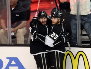 Drew Doughty, left, celebrates with Dustin Brown during the playoffs last season.