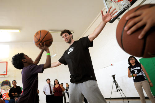 Pau Gasol of the Los Angeles Lakers plays basketball with youngsters at the Los Angeles Boys & Girls Club June 3, 2013.  Gasol hosted a pep rally at the facility to encourage kids to spend their summer engaging in healthy activities.(Andy Holzman/Staff Photographer)