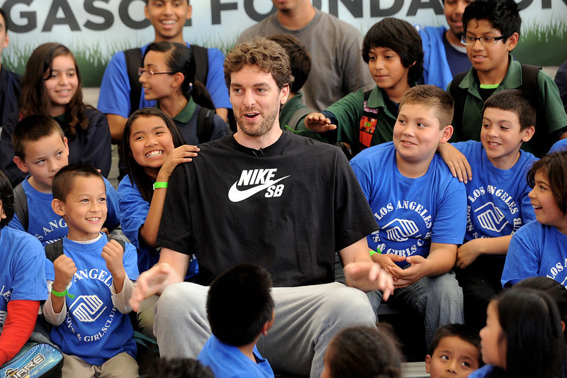 Lakers forward Pau Gasol, at the Los Angeles Boys & Girls Club earlier this summer, made a step in his knee rehab by receiving clearance to run on grass. (Andy Holzman/Staff Photographer)