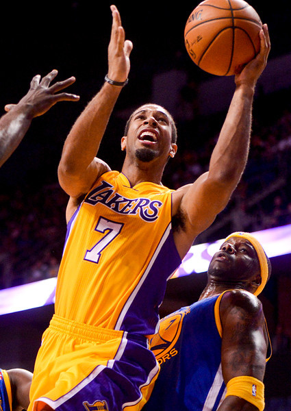 Los Angeles Laker Xavier Henry makes an attempt for the basket against Golden State Warrior defense during a preseason Lakers game against the Warriors at the Citizens Business Bank Area in Ontario on Saturday, Oct. 5, 2013. (Photo by Rachel Luna / San Bernardino Sun)