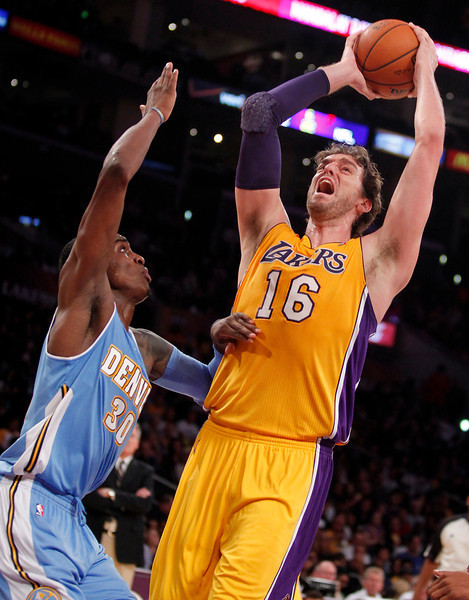 Los Angeles Lakers forward Pau Gasol (16), of Spain, takes a shot with Denver Nuggets forward Quincy Miller defending in the second quarter during an NBA preseason basketball game Sunday, Oct. 6, 2013 in Los Angeles. (AP Photo/Alex Gallardo)
