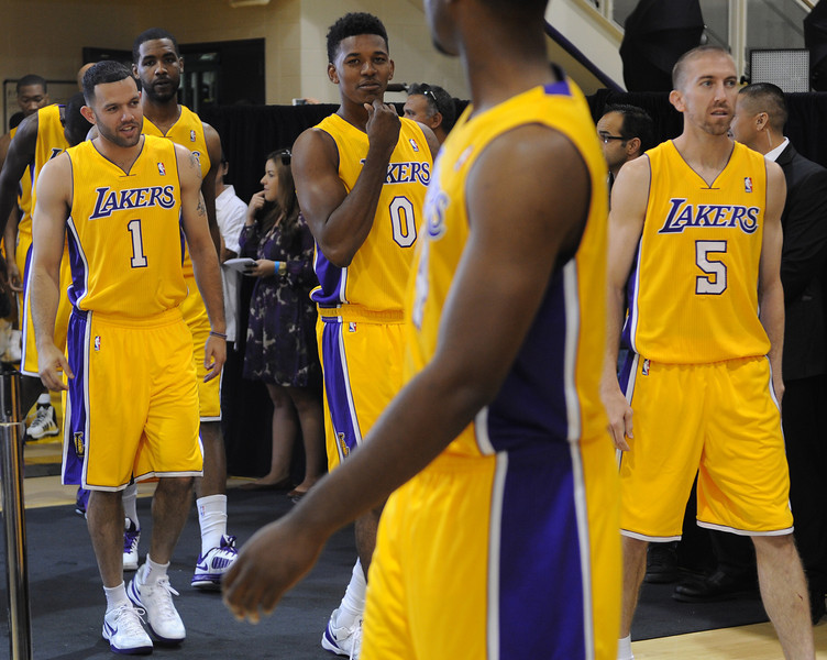 Lakers #1 Jordan Farmar, #0 Nick Young and #5 Steve Blake enter the practice facility for media day. The Los Angeles Lakers held a media day at their El Segundo practice facility. Players were photographed for team materials, and interviewed by the press. El Segundo, CA. 9/27/2013. photo by (John McCoy/Los Angeles Daily News)