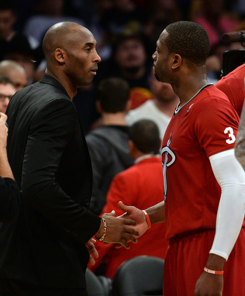 The Lakers’ Kobe Bryant gets shakes hands with Dwyane Wade after their game at the Staples Center December 25, 2013. The Heat beat the Lakers 101-95. (Photo by Hans Gutknecht/Los Angeles Daily News)