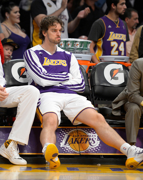 Los Angeles Lakers center Pau Gasol, of Spain, sits on the bench during the second half of an NBA basketball game against the Portland Trail Blazers, Sunday, Dec. 1, 2013, in Los Angeles. (AP Photo/Mark J. Terrill)