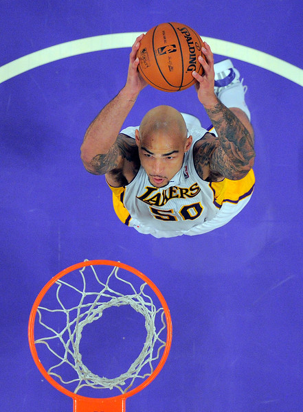 Lakers center Robert Sacre tries to stay positive with fluctuating playing time (AP Photo/Mark J. Terrill)