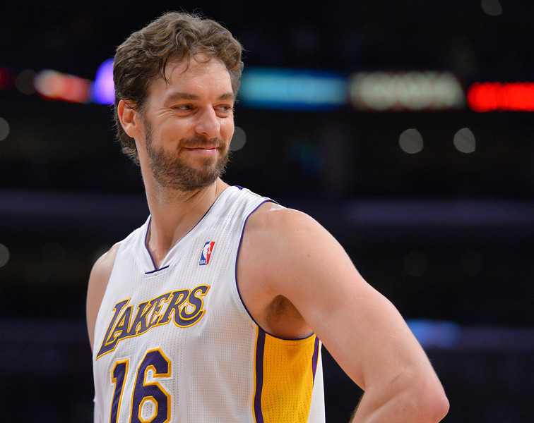Lakers' Pao Gasol smiles a a young fan in the front row as he waits for a freethrow against the Denver Nuggets at the Staple Center in Los Angeles, CA on Sunday, January 5, 2014. 1st half.  (Photo by Scott Varley, Daily Breeze)