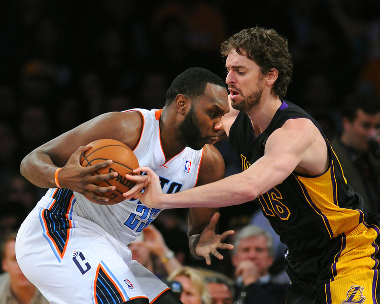 The Lakers' Pau Gasol defends the Charlotte Bobcats' Al Jefferson in the first half, Friday, January 31, 2014, at Staples Center. (Photo by Michael Owen Baker/L.A. Daily News)