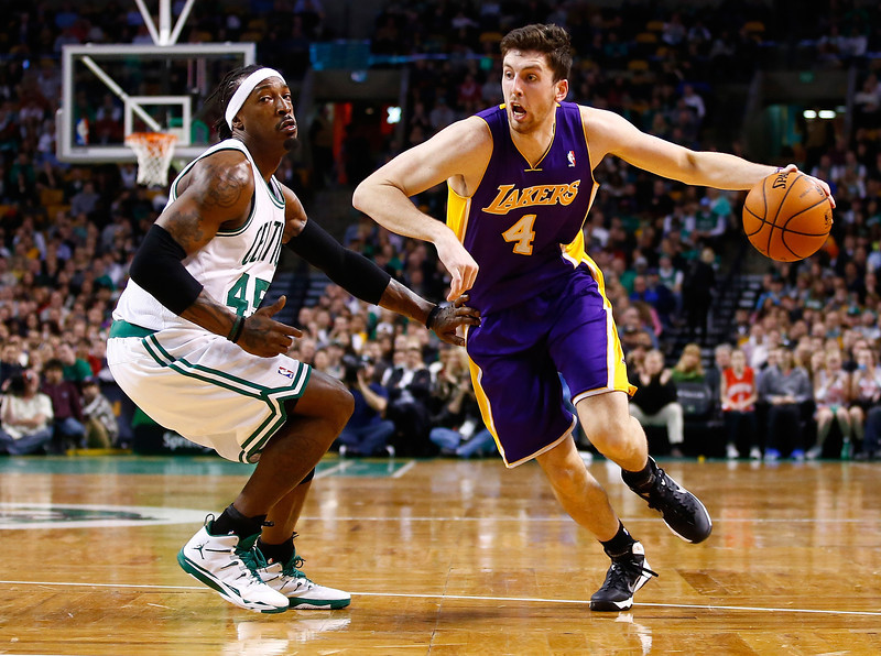 Ryan Kelly #4 of the Los Angeles Lakers drives to the basket past Gerald Wallace #45 of the Boston Celtics in the second half during the game at TD Garden on January 17, 2014 in Boston, Massachusetts. (Photo by Jared Wickerham/Getty Images) 