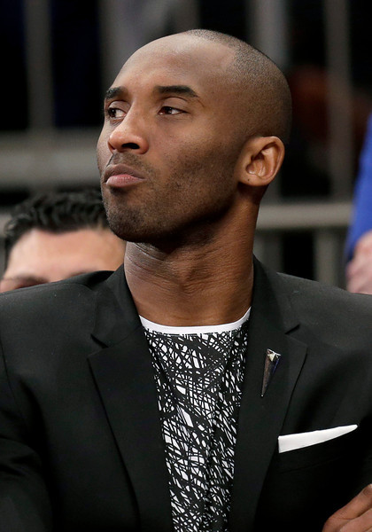 Los Angeles Lakers' Kobe Bryant looks on from the bench during the second half of an NBA basketball game against the New York Knicks at Madison Square Garden, Sunday, Jan. 26, 2014, in New York. The Knicks defeated the Lakers 110-103. (AP Photo/Seth Wenig)
