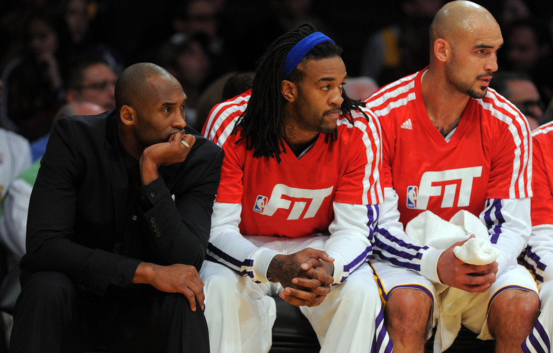 Injured Lakers star Kobe Bryant, left, watches the action from the bench against the Nuggets at the Staple Center in Los Angeles, CA on Sunday, January 5, 2014. 1st half.  (Photo by Scott Varley, Daily Breeze)