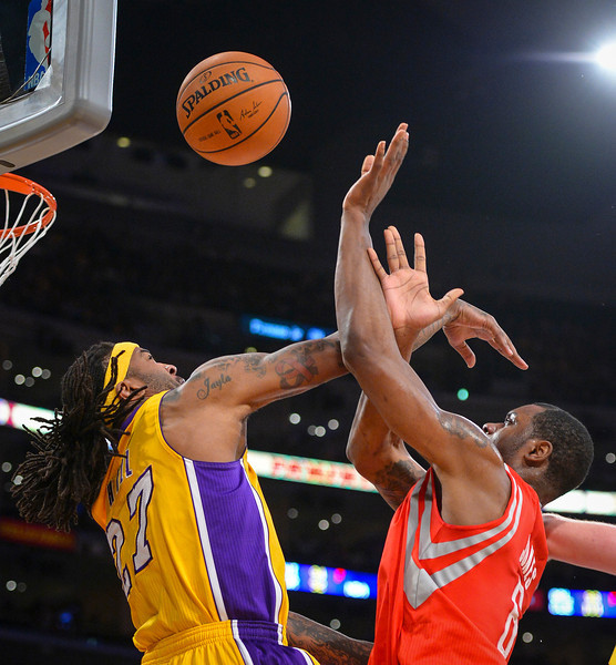 Lakers' Jordan Hill defends as Rockets' Terrence Jones takes a shot during first half action at Staples Center Wednesday, February 19, 2014. ( Photo by David Crane/Los Angeles Daily News )
