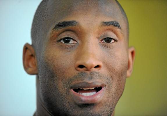 Kobe Bryant talks to media at Lakers practice earlier this season. (Photo by Brad Graverson/The Daily Breeze
