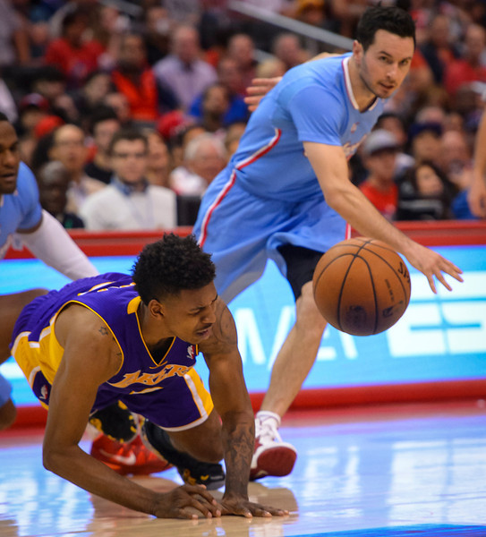 Lakers’ Nick Young goes down trying to chase down a loose ball during game action at Staples Center Sunday April 6, 2014. Clippers defeated the Lakers 120-97. ( Photo by David Crane/Los Angeles Daily News ) 