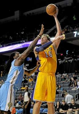 Los Angeles Lakers' Pau Gasol shoots over Denver's Kenneth Faried during the first half of an NBA preseason game, at Citizens Business Bank Arena, Ontario. (John Valenzuela/Staff Photographer) 