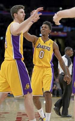 The Lakers' Ryan Kelly and Nick Young celebrate a shot late in the 4th quarter The Cleveland Cavaliers defeated the Lakers 120 to 118 in a regular season NBA game at Staples Center. Los Angeles, CA January 14, 2014.(John McCoy/Los Angeles Daily News) 