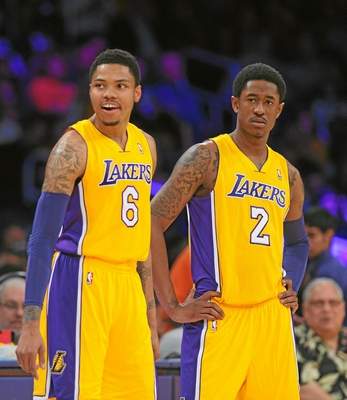  Newly-aquired Lakers Kent Bazemore, left, and MarShon Brooks wait at the scorers table during a timeout in the first half, Friday, February 21, 2014, at Staples Center. (Photo by Michael Owen Baker/L.A. Daily News) 
