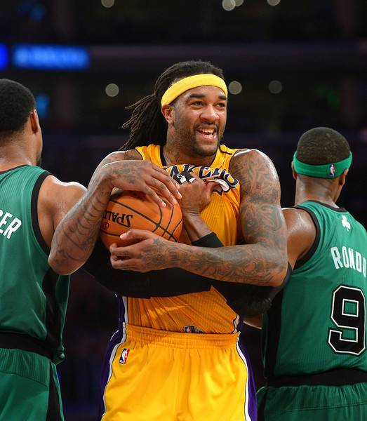The Lakers' Jordan Hill smiles after securing a rebound before a timeout and the lead against the Celtics, Friday, February 21, 2014, at Staples Center. (Photo by Michael Owen Baker/L.A. Daily News)