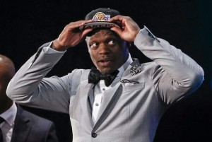  Kentucky forward Julius Randle dons a Los Angeles Lakers cap after being selected seventh overall by the Lakers during the 2014 NBA draft, Thursday, June 26, 2014, in New York. (AP Photo/Jason DeCrow) 