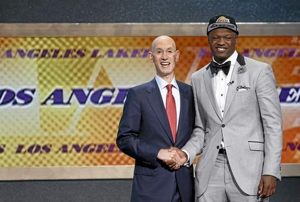Kentucky forward Julius Randle, right, poses for a photo with NBA commissioner Adam Silver after being selected seventh overall by the Los Angeles Lakers during the 2014 NBA draft, Thursday, June 26, 2014, in New York. (AP Photo/Kathy Willens)
