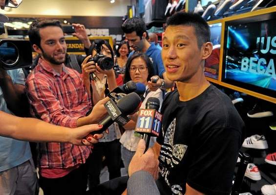 New Laker Jeremy Lin talks about the upcoming season before signing autographs for fans at a shoe store in Culver City. SCOTT VARLEY — STAFF PHOTOGRAPHER