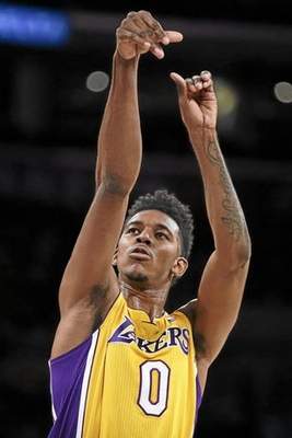  Lakers forward Nick Young injured his thumb Thursday and will be out for six to eight weeks. Chris Carlson — AP 