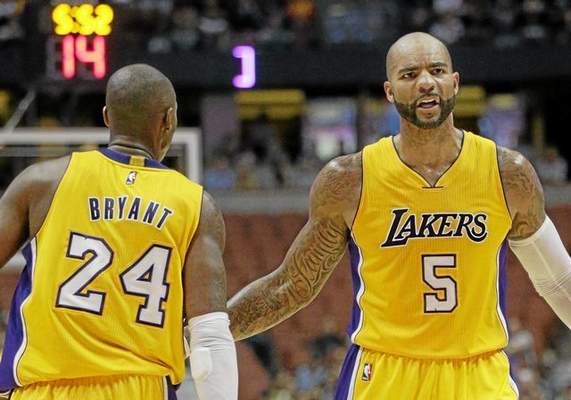 Kobe Bryant (24), Carlos Boozer (5) and Jeremy Lin (not pictured) sat out Saturday’s practice with the L.A. Lakers. Boozer and Lin are listed as probably, while Bryant was given the day off in order to be rested for their game against Denver at Staples Center Sunday, Nov. 23, 2014. (File photo/AP Photo) 