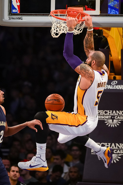 "Lakers Carlos Boozer slams in two points during first half action at Staples Center Sunday, December 7, 2014.   ( Photo by David Crane/Los Angeles Daily News ) "