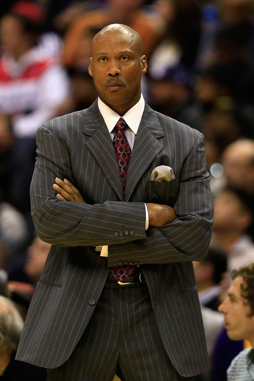 Head coach Byron Scott of the Los Angeles Lakers looks on from the bench during the first half against the Washington Wizards at Verizon Center on December 3, 2014 in Washington, DC. (Photo by Rob Carr/Getty Images) 