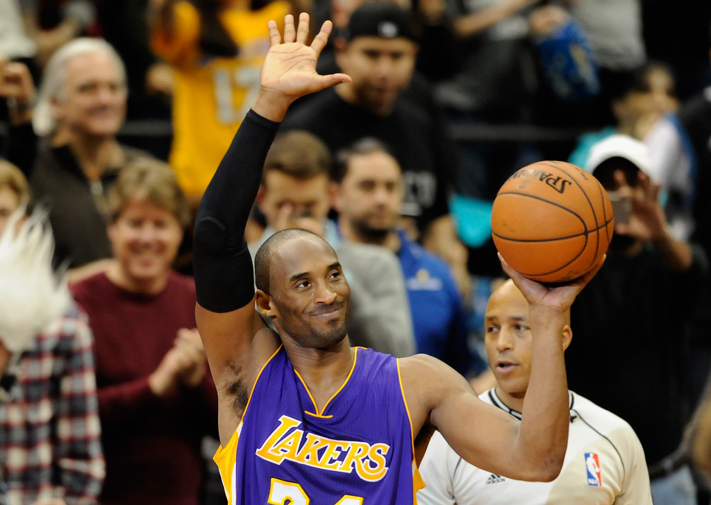 "MINNEAPOLIS, MN - DECEMBER 14: Kobe Bryant #24 of the Los Angeles Lakers waves to the crowd after passing Michael Jordan on the all-time scoring list with a free throw in the second quarter of the game on December 14, 2014 at Target Center in Minneapolis, Minnesota. NOTE TO USER: User expressly acknowledges and agrees that, by downloading and or using this Photograph, user is consenting to the terms and conditions of the Getty Images License Agreement. (Photo by Hannah Foslien/Getty Images)"
