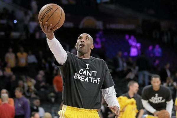 Los Angeles Lakers' Kobe Bryant warms up before an NBA basketball game against the Sacramento Kings, Tuesday, Dec. 9, 2014, in Los Angeles. Several athletes have worn "I Can't Breathe" shirts during warm ups in support of the family of Eric Garner, who died July 17 after a police officer placed him in a chokehold when he was being arrested for selling loose, untaxed cigarettes. (AP Photo/Jae C. Hong) 