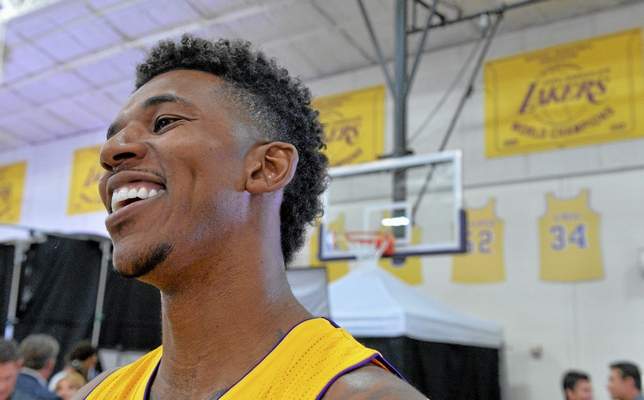 Nick Young, flashing his signature smile despite his uneven on-court performances, enjoys being a Laker in what has been another tough year. (Thomas R. Cordova photo) 