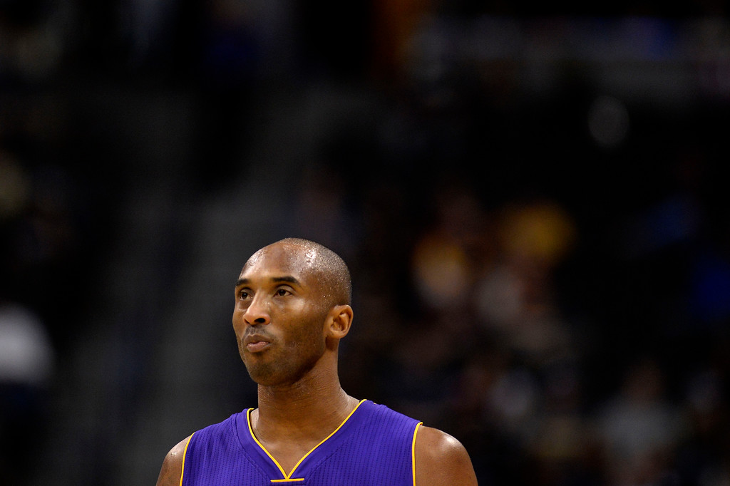 "DENVER, CO - DECEMBER 30: Kobe Bryant (24) of the Los Angeles Lakers watches as the Denver Nuggets attempt a pair of free throws during the first quarter of action. The Denver Nuggets hosted the Los Angeles Lakers at the Pepsi Center on Monday, December 30, 2014. (Photo by AAron Ontiveroz/The Denver Post)"