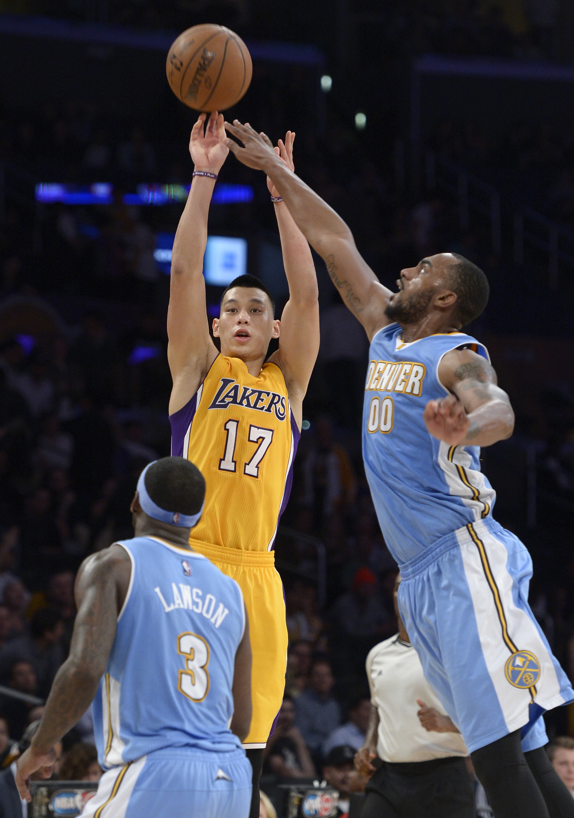 Lakers#17 Jeremy Lin shoots, but can not hit a 3-pointer against Nuggets#3 Ty Lawson and Nuggets#00 Darrell Arthur in the 4th quarter. The Denver Nuggets defeated the Los Angeles Lakers 106-96 at Staples Center in Los Angeles, CA February 10, 2015.  (Photos by John McCoy / Los Angeles Daily News)