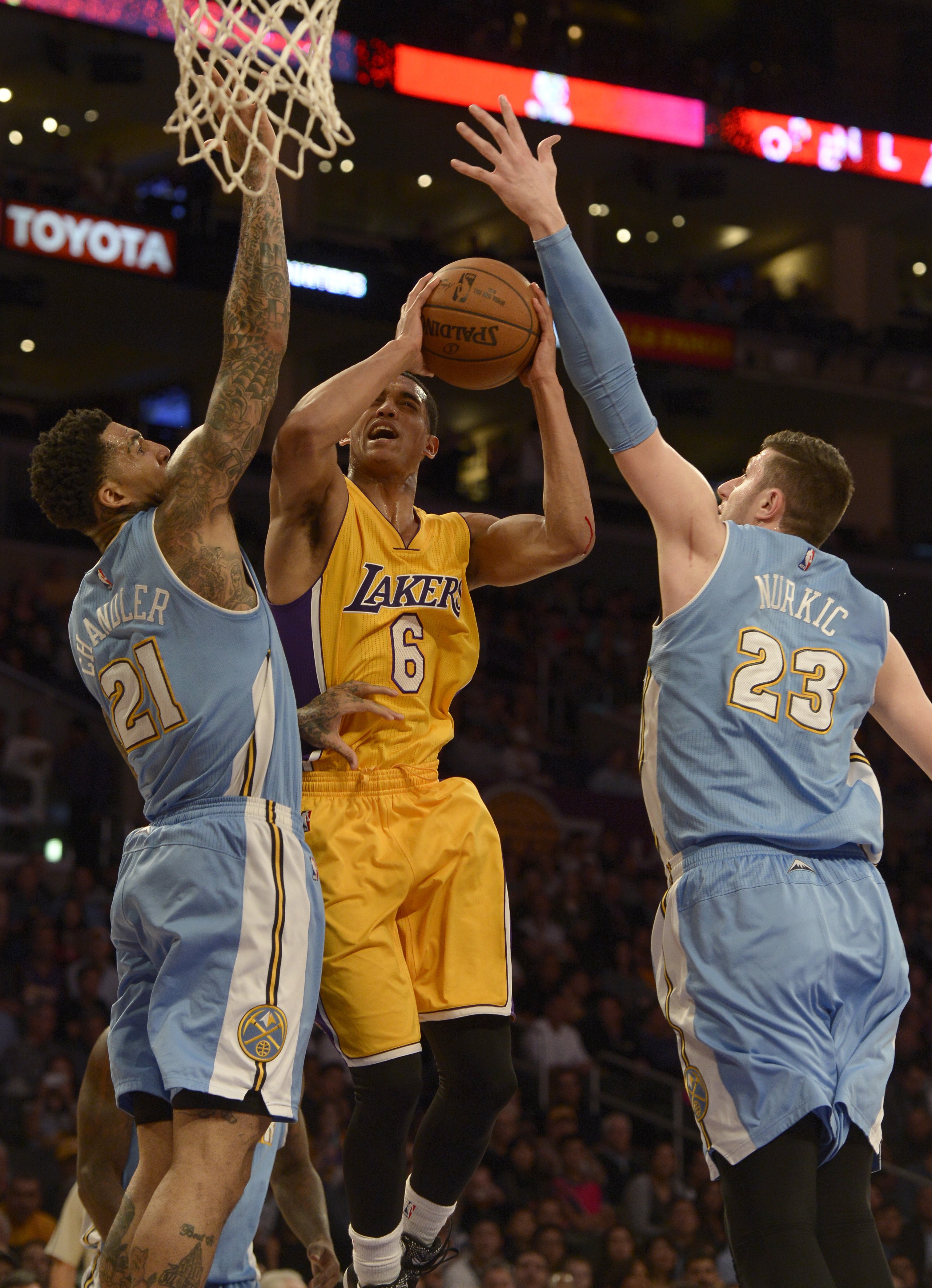 Lakers#6 Jordan Clarkson is contested by "n21" and Nuggets#23 Jusuf Nurkic in the first half. The Los Angeles Lakers hosted the Denver Nuggets at Staples Center in Los Angeles, CA February 10, 2015.  (Photos by John McCoy / Los Angeles Daily News)