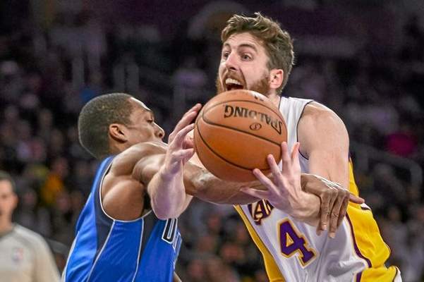 Lakers Ryan Kelly gets fouled by Mavricks Rajon Rondo during first half action at Staples Center Sunday, April 12, 2015. ( Photo by David Crane/Los Angeles Daily News ) 