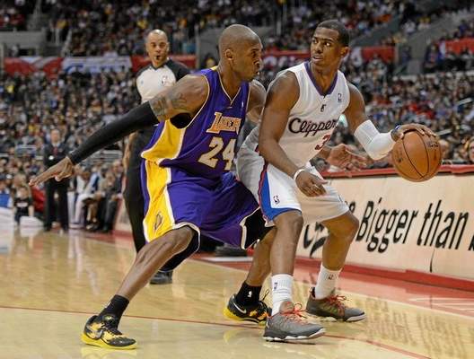 Chris Paul of the Clippers keeps his dribble away from Kobe Bryant of the Lakers during a 107-102 Clippers win at Staples Center on Jan. 4, 2013, at Staples Center. (Harry How/Getty Images) 