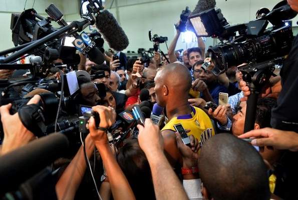 Kobe Bryant is swarmed Monday as he talks about the upcoming season, which is expected to be his last in a Lakers uniform. ROBERT CASILLAS — STAFF PHOTOGRAPHER