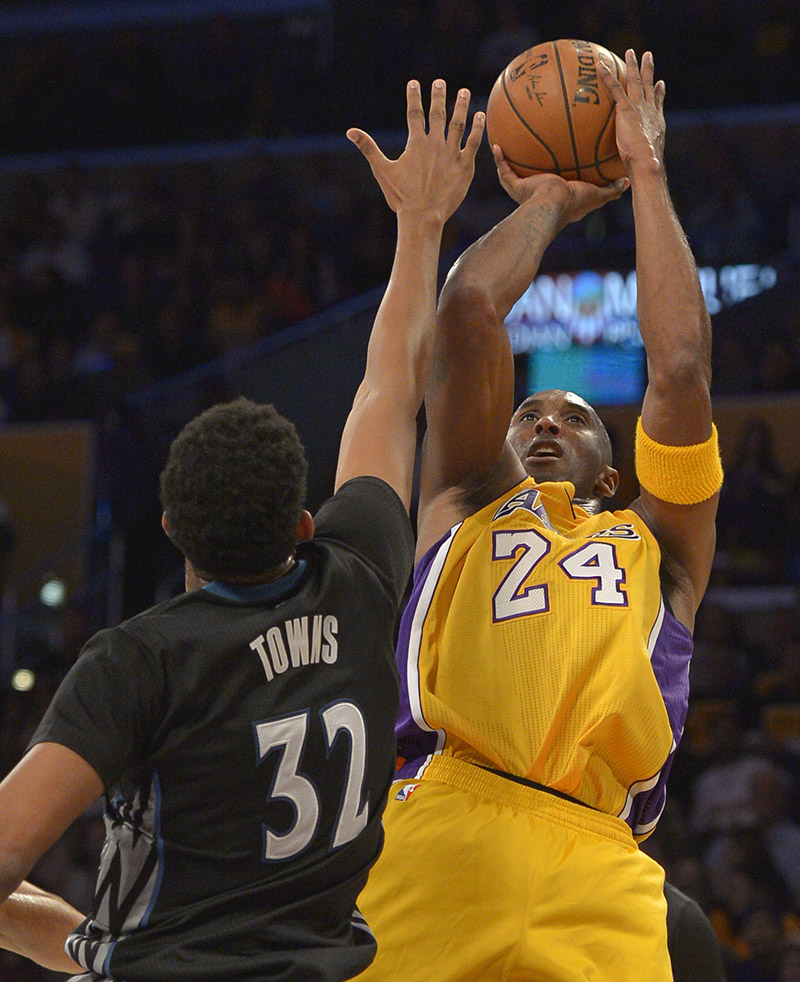 Los Angeles Lakers guard Kobe Bryant #24 shoots over Minnesota Timberwolves center Karl-Anthony Towns #32 in the first quarter. The Lakers played the Minnesota Timberwolves in the opening game of the 2015-16 NBA season. Los Angeles, CA, 10/28/2015 (photo by John McCoy/Los Angeles News Group)