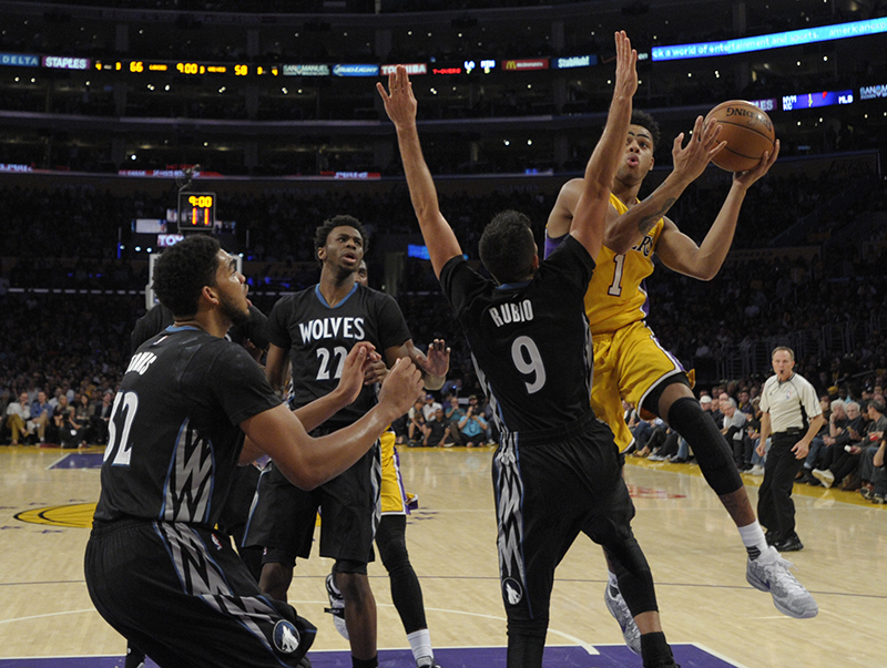 Los Angeles Lakers guard D'Angelo Russell #1 drives to the hoop against Minnesota Timberwolves guard Ricky Rubio #9 in the 3rd quarter. The Lakers lost to the Minnesota Timberwolves 112-111 in the opening game of the 2015-16 NBA season. Los Angeles, CA, 10/28/2015 (photo by John McCoy/Los Angeles News Group)