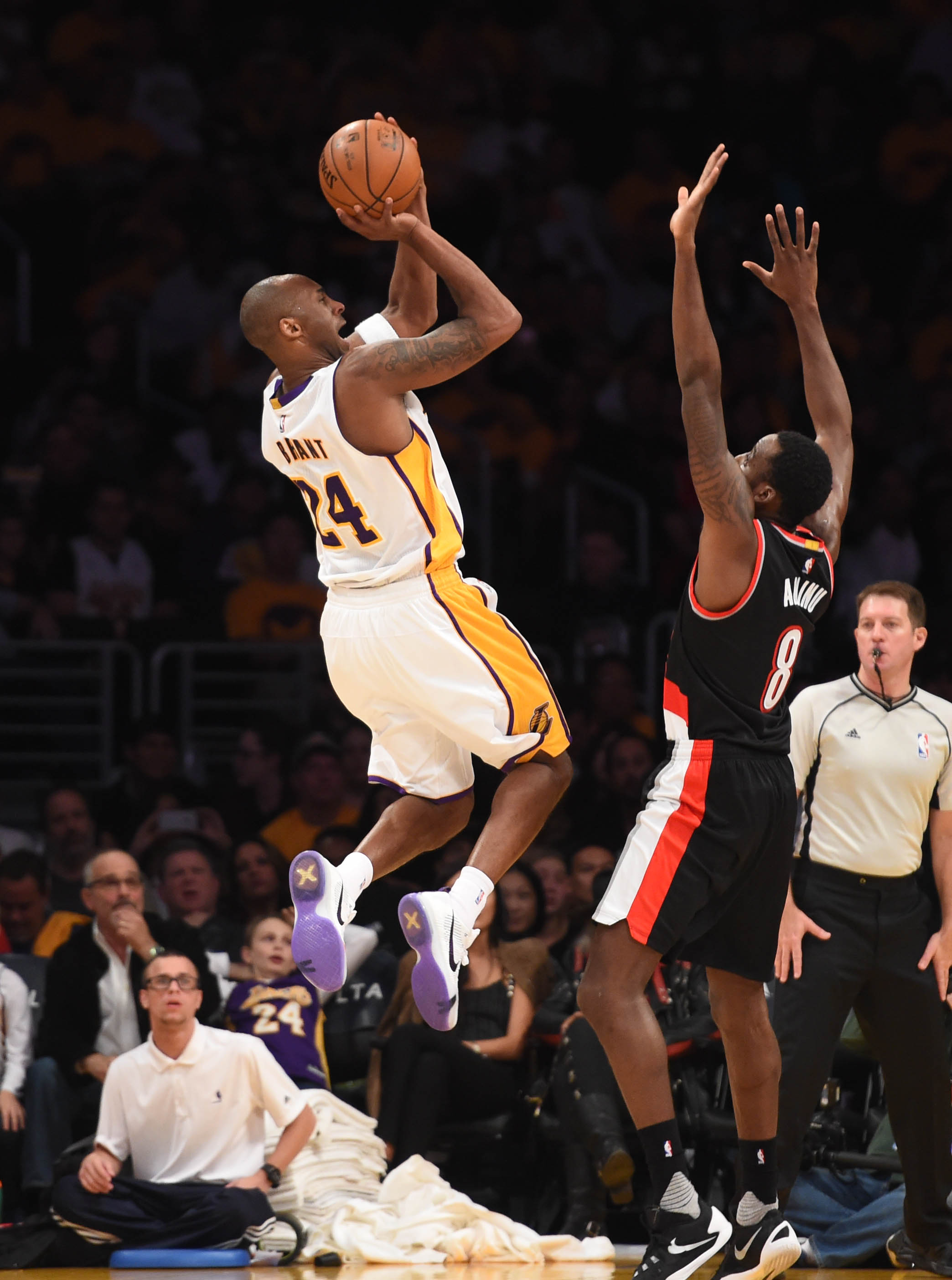 Los Angeles Lakers Kobe Bryant ,24, misses a shot against Portland's Al-Farouq Aminu,8, during the third quarter at the Staples Center.  Los Angeles Calif., Sunday, November,22, 2015.         (Photo by Stephen Carr / Daily Breeze)