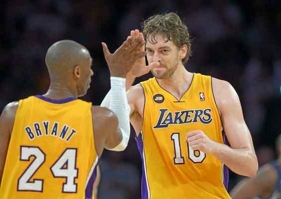 Lakers' Kobe Bryant high fives ex teammate Pau Gasol during game at Staples Center in 2013. (AP Photo/Mark J. Terrill) 