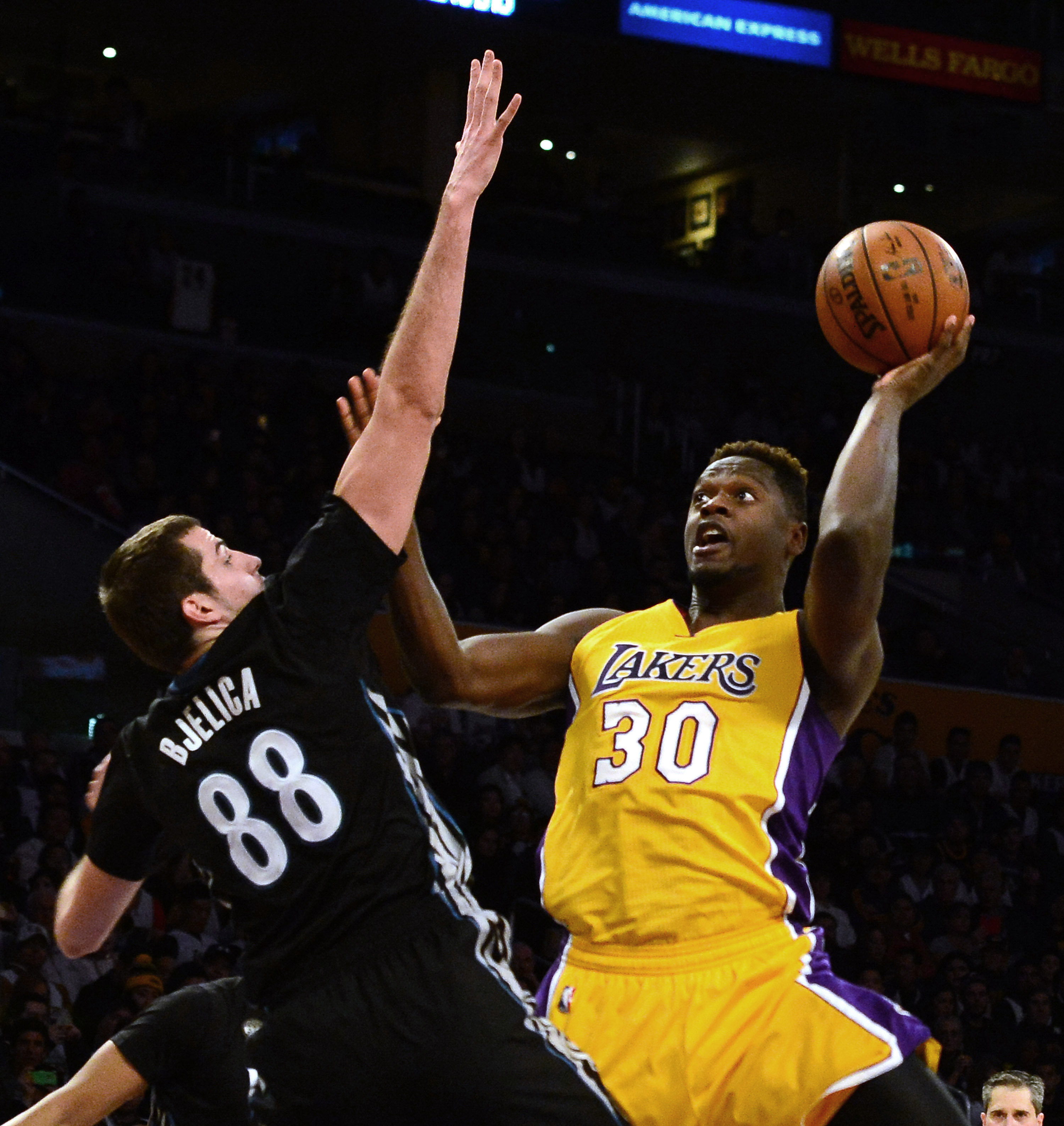 Los Angeles Lakers forward Julius Randle (30) shoots over Minnesota Timberwolves forward Nemanja Bjelica (88) in the first half of a NBA basketball game at Staples Center on Tuesday, Feb. 2, 2015 in Los Angeles.   (Photo by Keith Birmingham/ Pasadena Star-News)