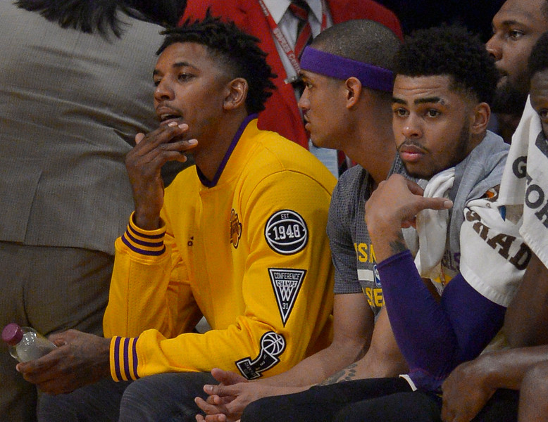 Nick Young Jordan Clarkson and D'Angelo Russell sit on the bench in the first half. The Los Angeles Lakers played the Miami Heat at Staples Center in Los Angeles, CA.  March 30, 2016.  (Photo by John McCoy/Los Angeles News Group)