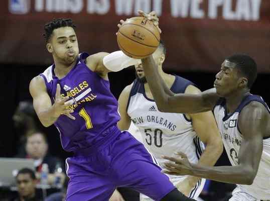 New Orleans' Cheick Diallo, right, and Los Angeles Lakers' DAngelo Russell battle for the ball during the second half of an NBA summer league basketball game, Friday, July 8, 2016, in Las Vegas. (AP Photo/John Locher) 