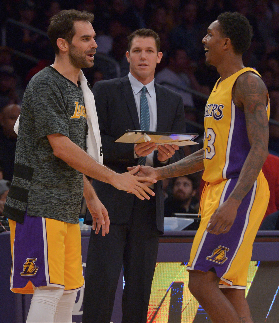 Los Angeles Lakers head coach Luke Walton look on as Los Angeles Lakers guard Jose Calderon #5 welcomes Los Angeles Lakers guard Louis Williams #23 to the bench in the first half. The Los Angeles Lakers played the Oklahoma City Thunder at Staples Center in Los Angeles, CA 11/22/2016. Photo by John McCoy/Los Angeles Daily News (SCNG)