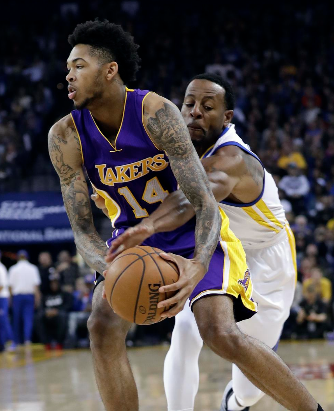 Lakers rookie Brandon Ingram drives to the basket as the Warriors' Andre Iguodala defends during the first half of Wednesday's game in Oakland. AP Photo: Marcio Jose Sanchez