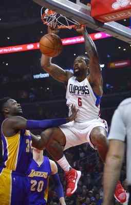 Clippers center DeAndre Jordan #6 dunks the ball in front of Los Angeles Lakers forward Julius Randle #30 in the first half. The Clippers defeated the Lakers 113-97 at Staples Center in Los Angeles, CA 1/14/2017. Photo by John McCoy/Los Angeles Daily News (SCNG) 